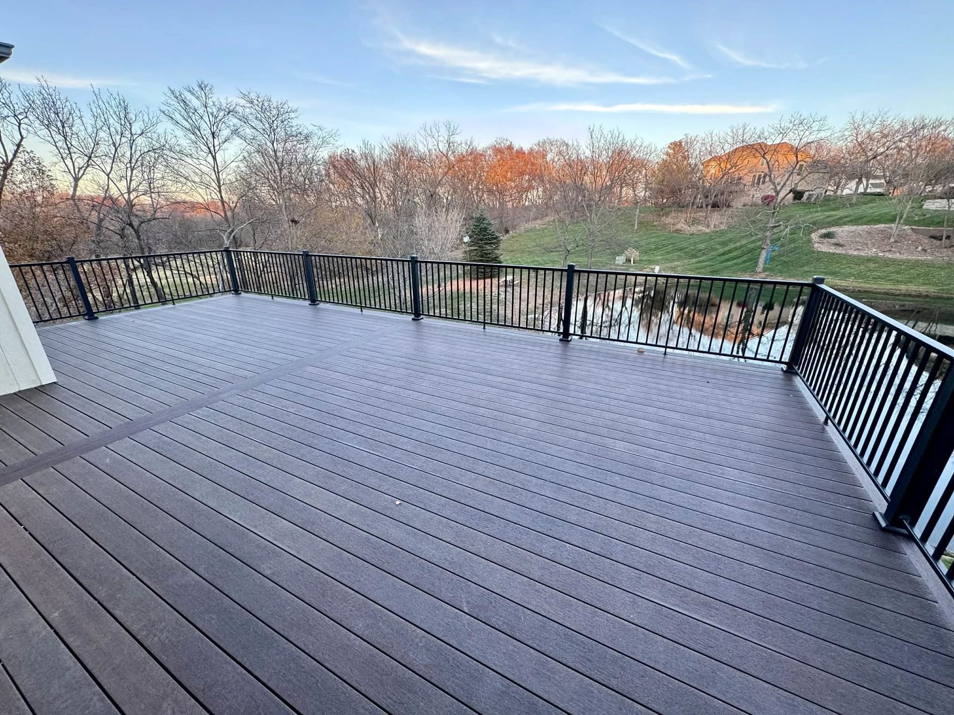 Wide composite deck overlooking open ground, built by Boyt Home Improvement in Overland Park