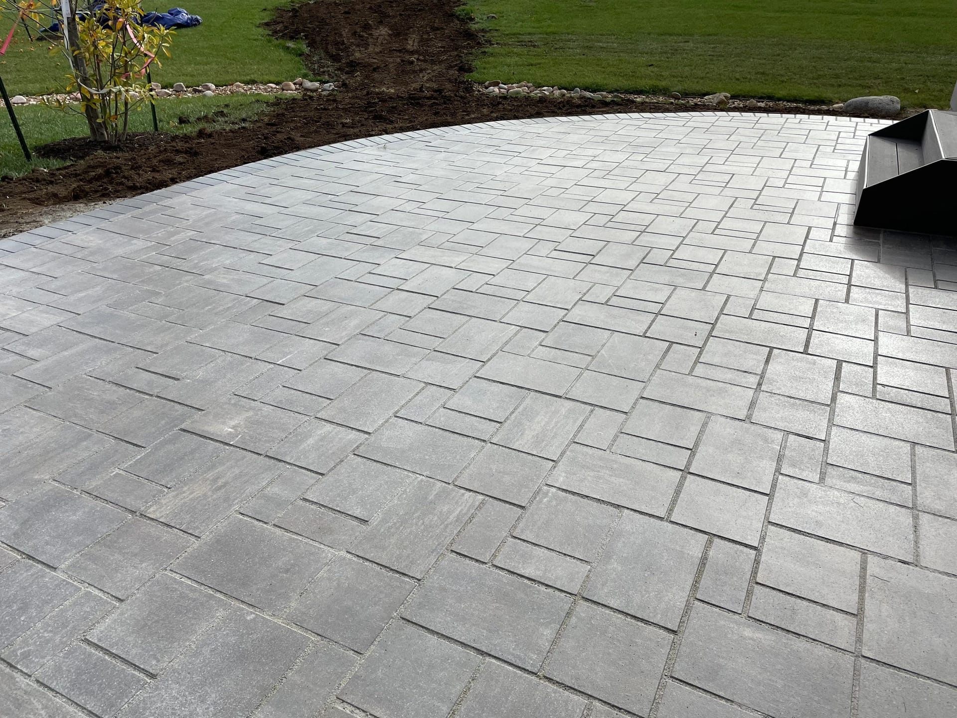 Paver patio laid in a running-bond pattern built by Boyt Home Improvement